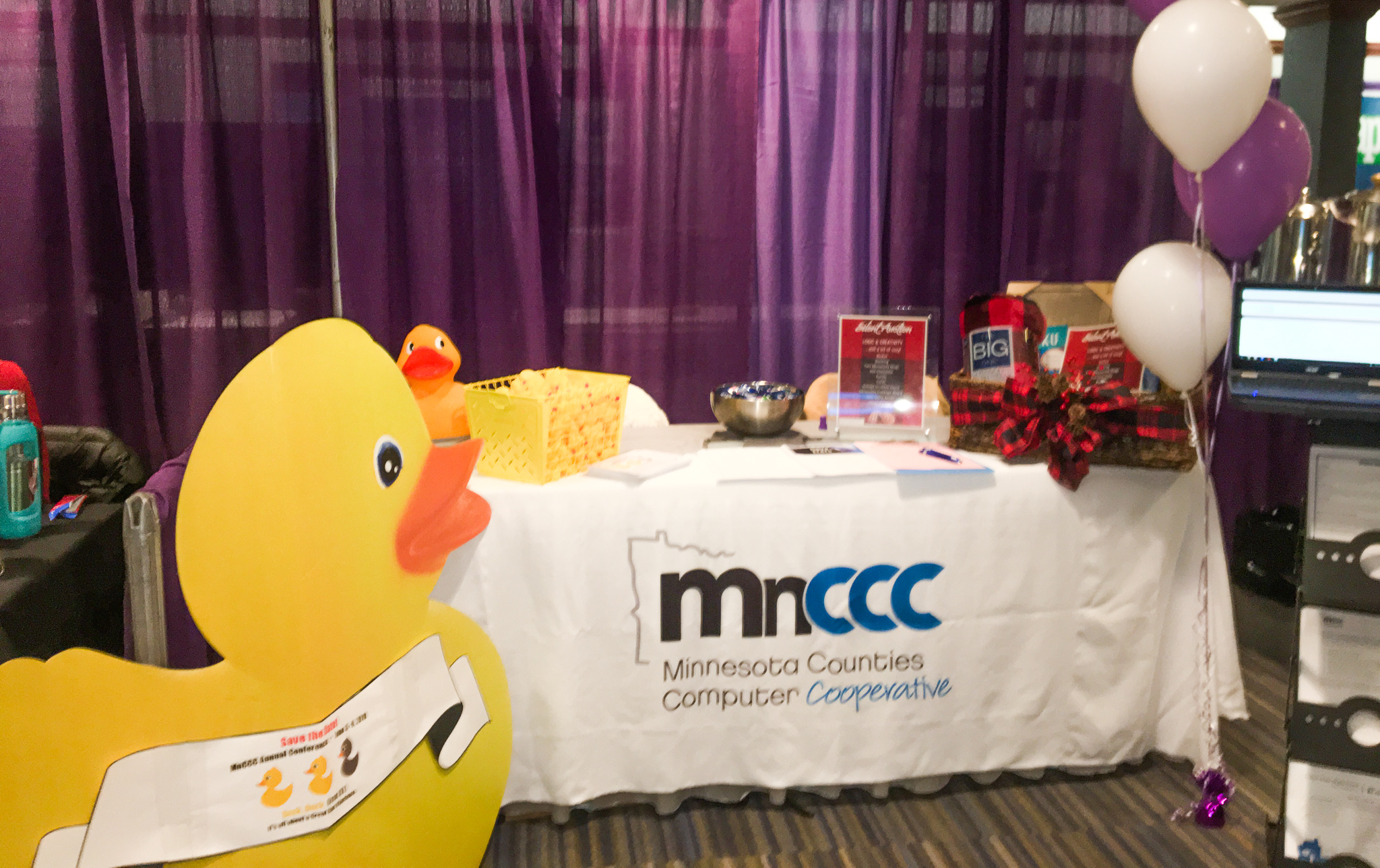 Photo of MnCCC booth with the big duck